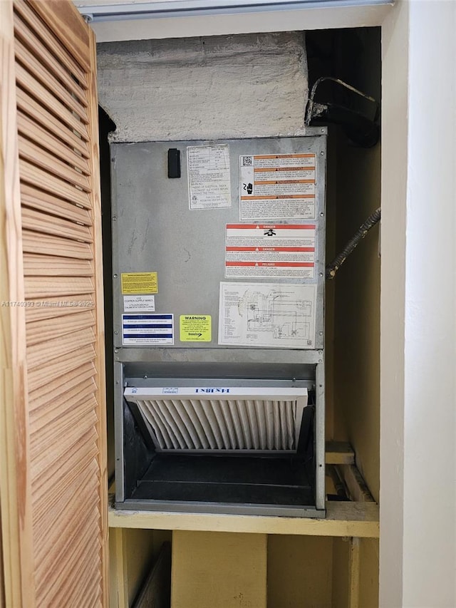 utility room featuring heating unit