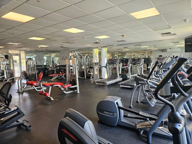 exercise room with a drop ceiling