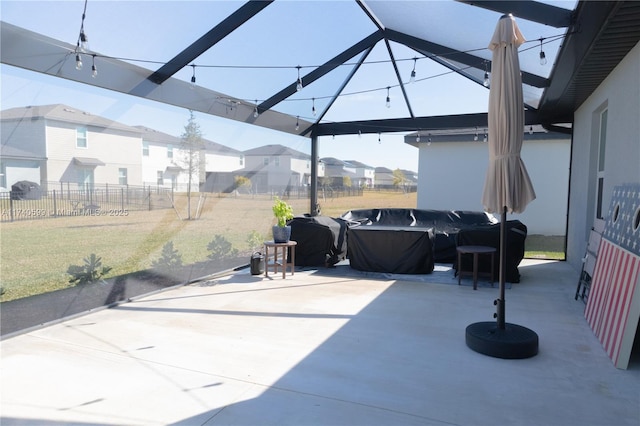 view of patio featuring a residential view and fence