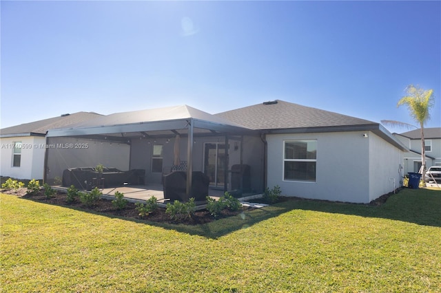 back of property featuring a lawn, a patio, and glass enclosure