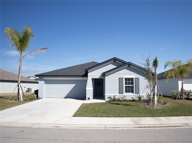 ranch-style home featuring a garage, driveway, a front lawn, and stucco siding