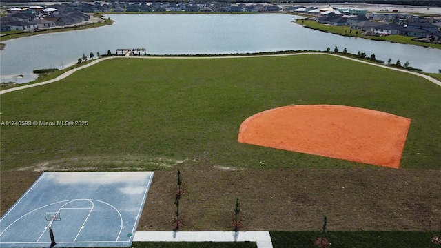 bird's eye view with a water view and a residential view