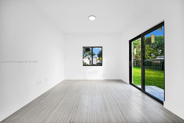 unfurnished room with a healthy amount of sunlight