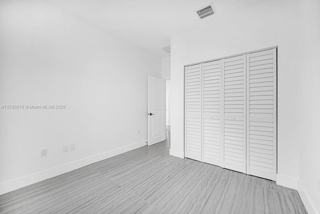 unfurnished bedroom featuring a closet