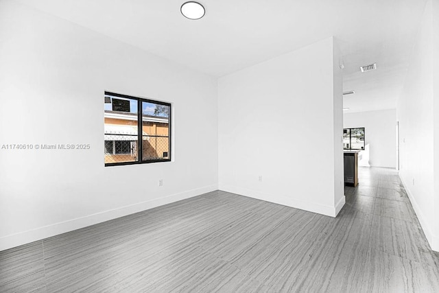 empty room featuring hardwood / wood-style floors