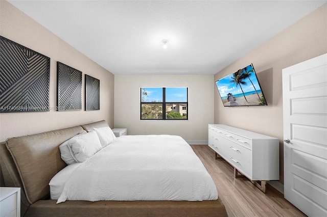 bedroom featuring wood-type flooring