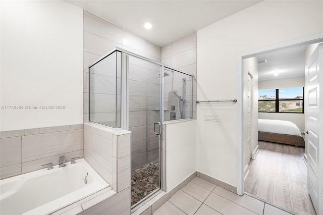 bathroom with tile patterned flooring and plus walk in shower