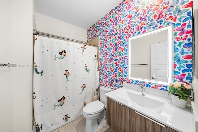 bathroom with vanity, toilet, and a shower with shower curtain