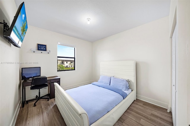 bedroom featuring wood-type flooring