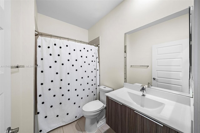 bathroom with vanity, toilet, and curtained shower