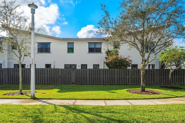 view of side of home with a lawn