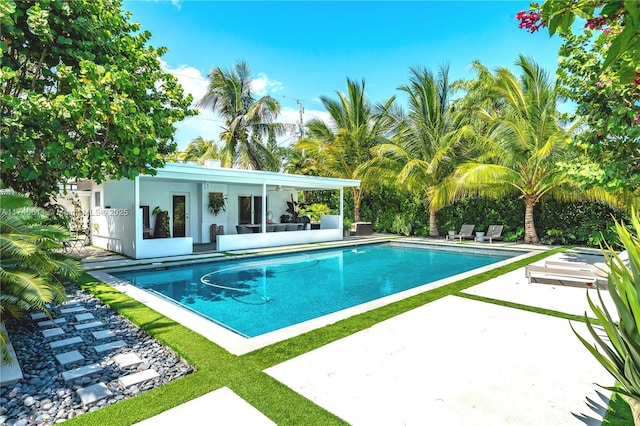 outdoor pool featuring a patio