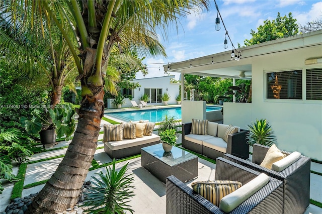 view of patio with an outdoor pool and an outdoor hangout area
