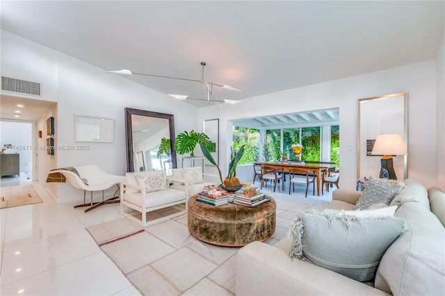 tiled living room featuring visible vents