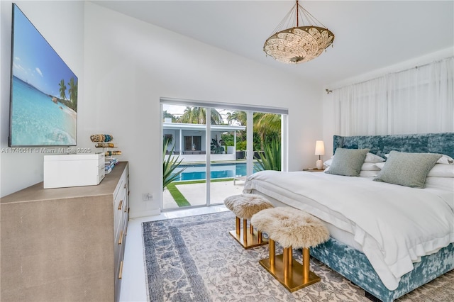 bedroom featuring access to outside and vaulted ceiling