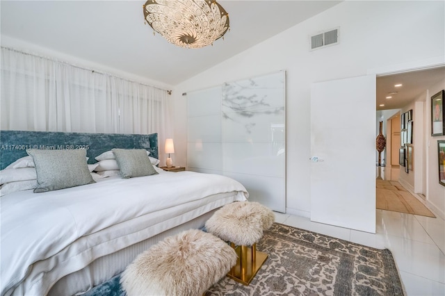 tiled bedroom featuring vaulted ceiling and visible vents
