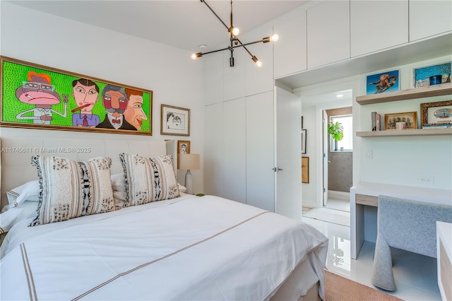 bedroom featuring a chandelier