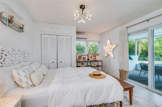 bedroom with access to outside, a wall mounted air conditioner, a notable chandelier, and a closet