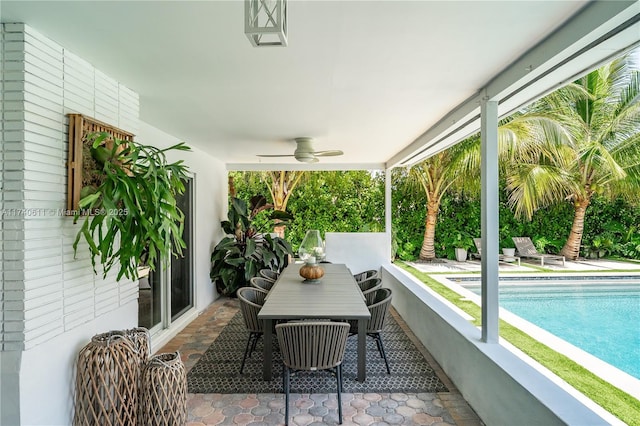 exterior space featuring ceiling fan and an outdoor pool