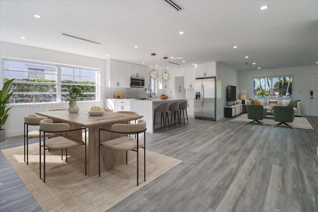 dining space featuring light hardwood / wood-style floors