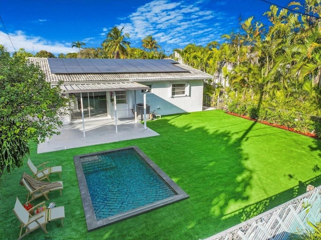 back of property featuring central air condition unit, a patio area, and a lawn