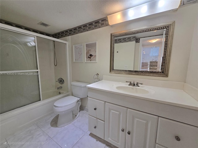 full bathroom with vanity, combined bath / shower with glass door, a textured ceiling, and toilet