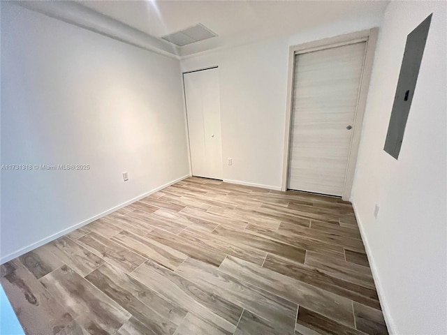 unfurnished bedroom featuring hardwood / wood-style floors