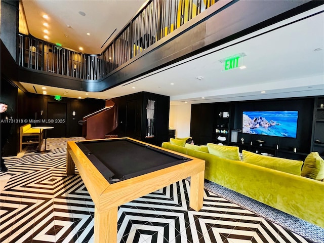 rec room featuring a towering ceiling and pool table