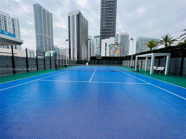 view of tennis court with basketball court