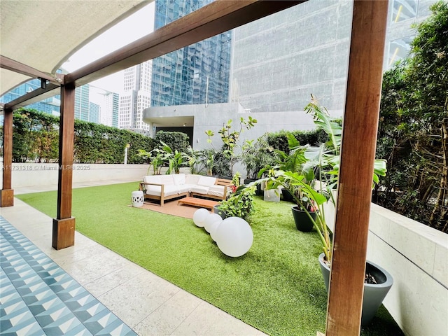 view of yard featuring an outdoor living space and a patio area