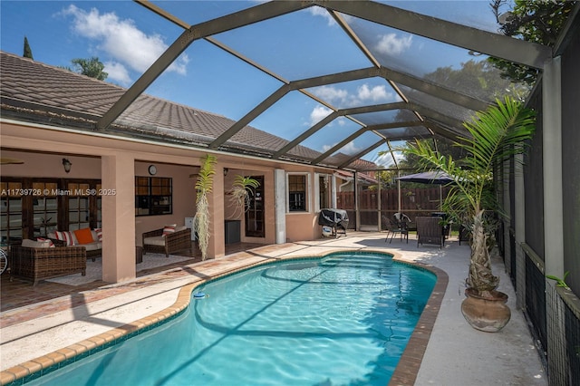 view of swimming pool with an outdoor living space, a patio, and glass enclosure