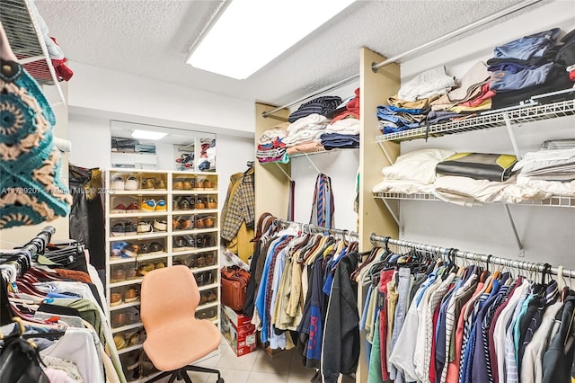 spacious closet with tile patterned flooring