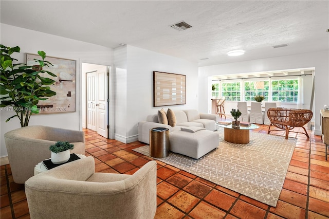 living room featuring a textured ceiling