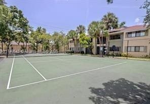 view of tennis court featuring basketball court