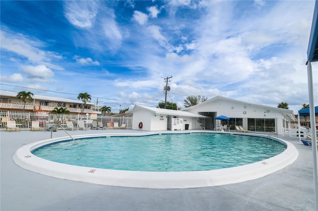 view of swimming pool with a patio area