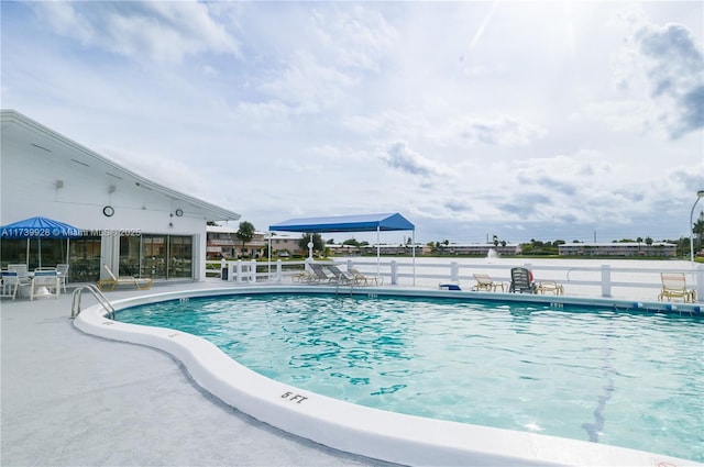 view of swimming pool featuring a patio