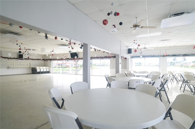 dining space featuring a paneled ceiling and ceiling fan