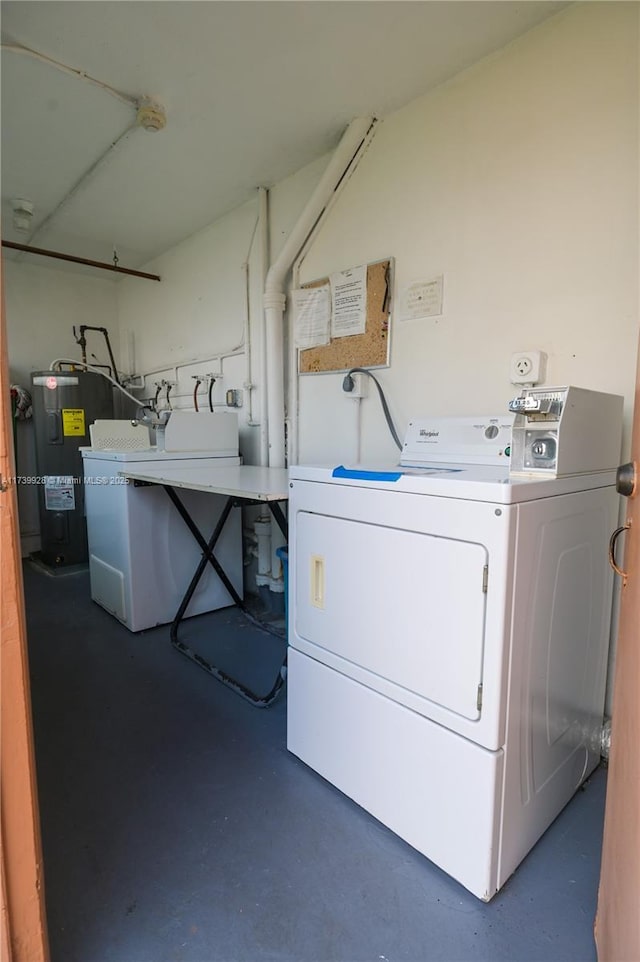 washroom featuring washing machine and clothes dryer and water heater