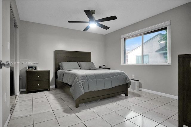 tiled bedroom with ceiling fan