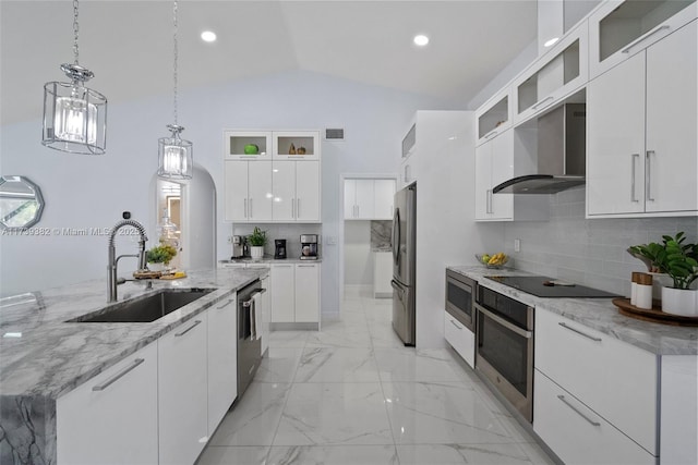 kitchen featuring sink, stainless steel appliances, white cabinets, a center island with sink, and wall chimney exhaust hood