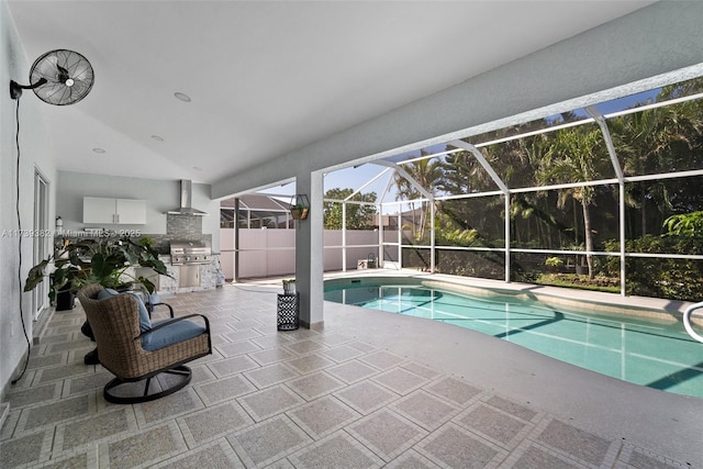 view of swimming pool with area for grilling, a lanai, and a patio area