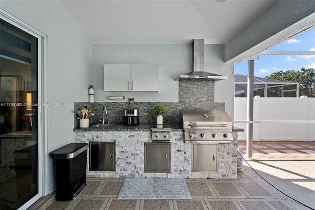 view of patio / terrace featuring a grill, a lanai, exterior kitchen, and sink