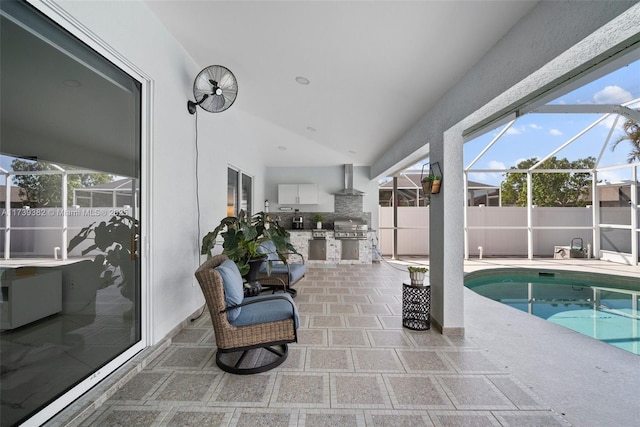 exterior space featuring area for grilling, a lanai, and a patio area