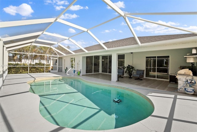 view of pool featuring a lanai and a patio area