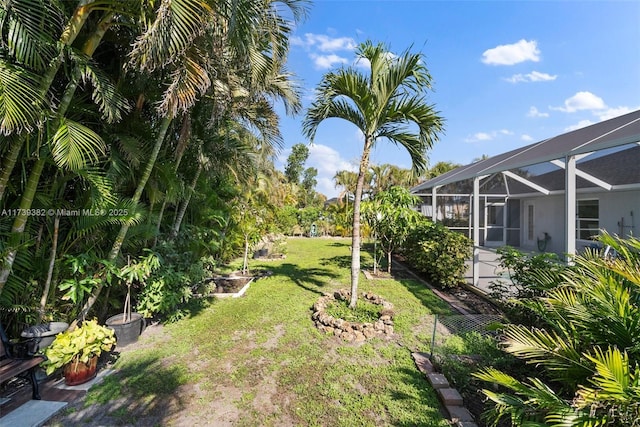 view of yard featuring a lanai