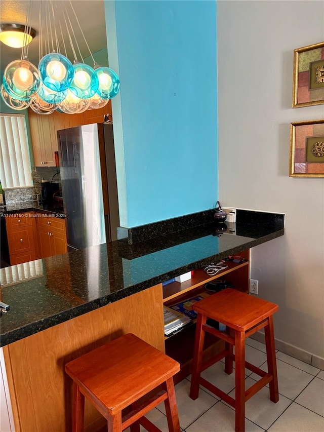 dining room with light tile patterned flooring