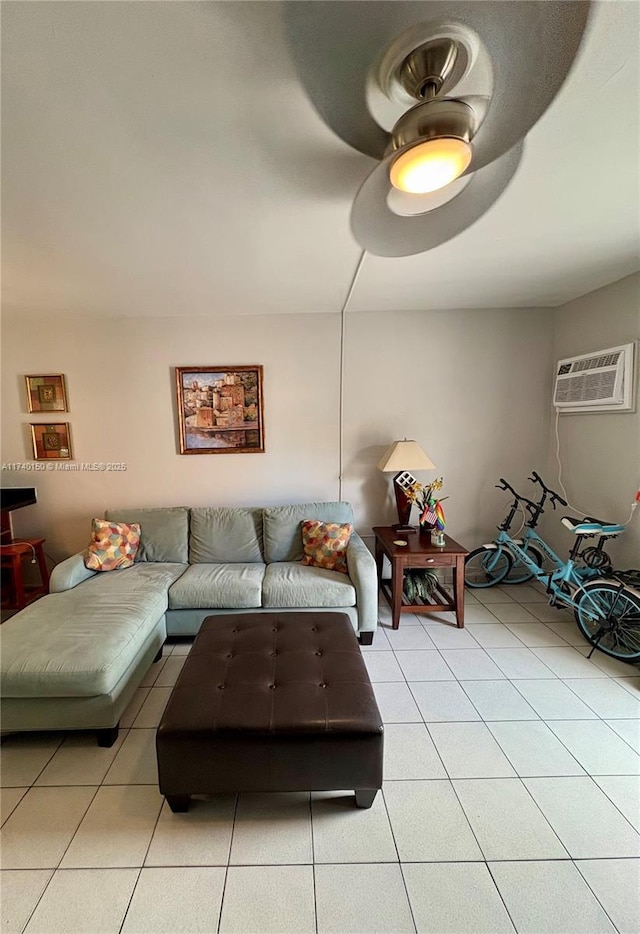 tiled living room with ceiling fan and a wall unit AC