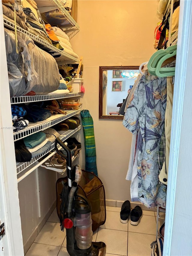 spacious closet with light tile patterned flooring