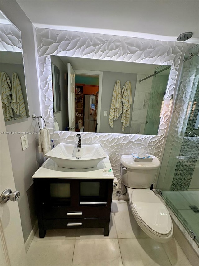 bathroom with vanity, an enclosed shower, tile patterned floors, and toilet