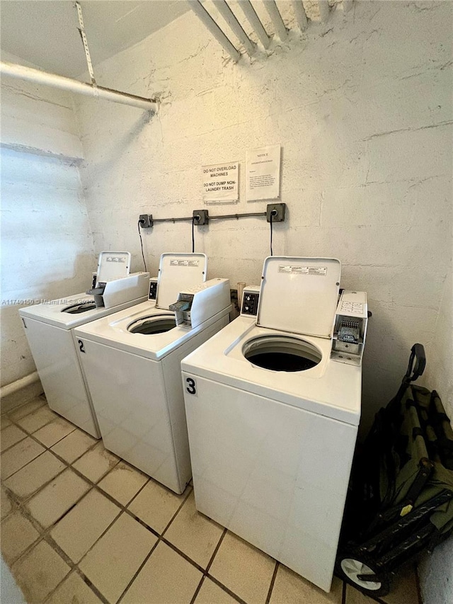 washroom with washing machine and dryer